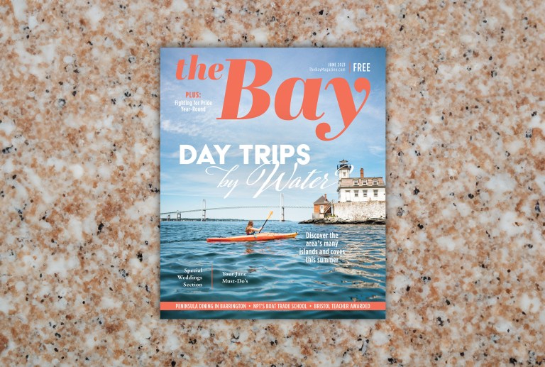 The Bay magazine example on a granite countertop background